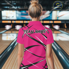 Load image into Gallery viewer, Back view of a female model wearing a pink, black, and white bowling polo shirt in a bowling alley