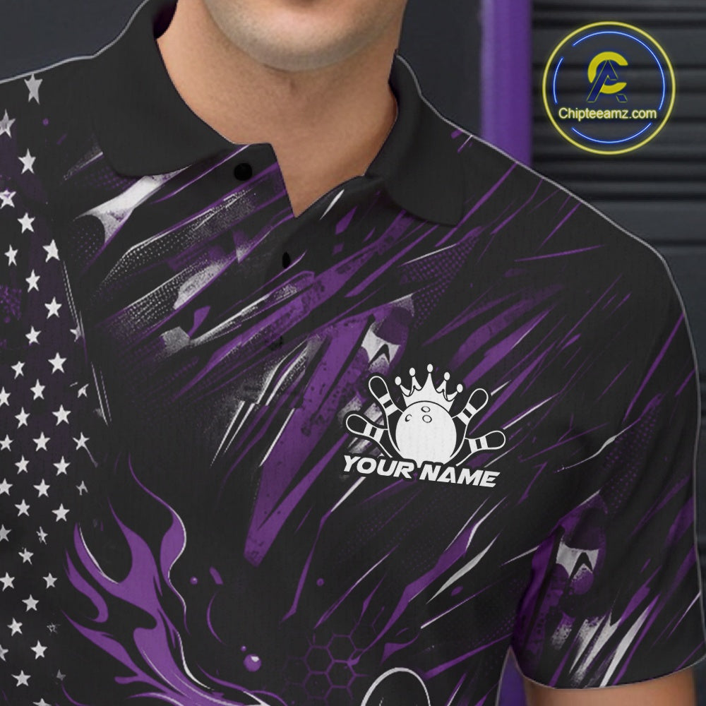 Close-up of the left chest area on a black and purple bowling polo shirt featuring a flaming bowling ball striking pins with patriotic accents.