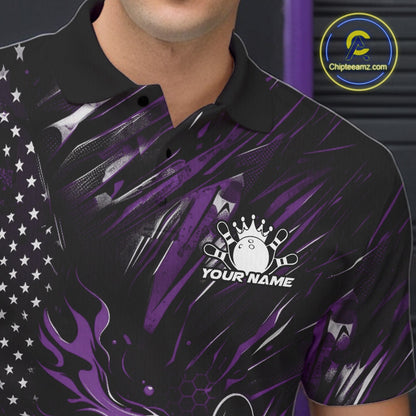 Close-up of the left chest area on a black and purple bowling polo shirt featuring a flaming bowling ball striking pins with patriotic accents.