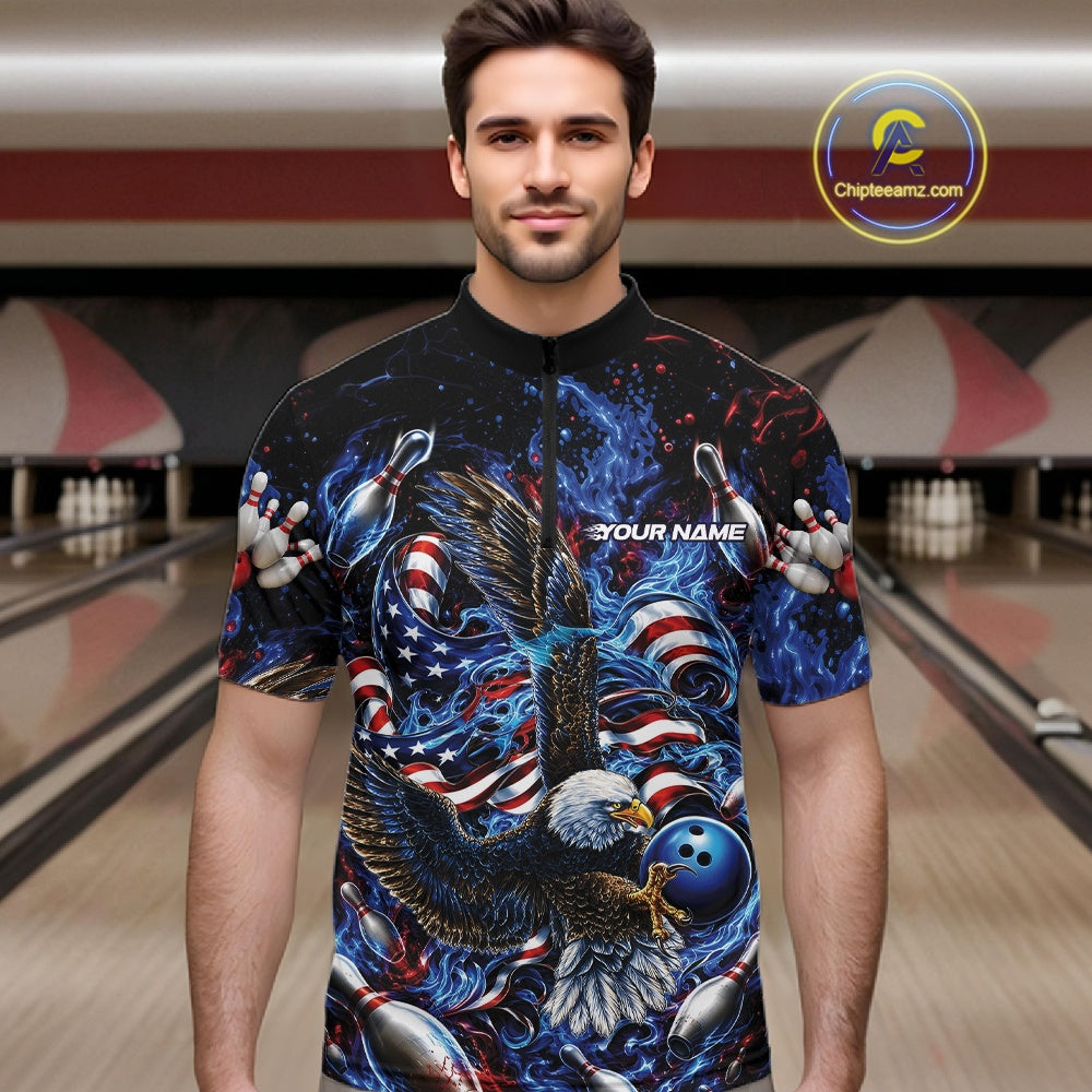 Front view male model in a bowling lane wearing a quarter zip shirt with flaming bald eagle, blue bowling ball, American flag, and blue flames.
