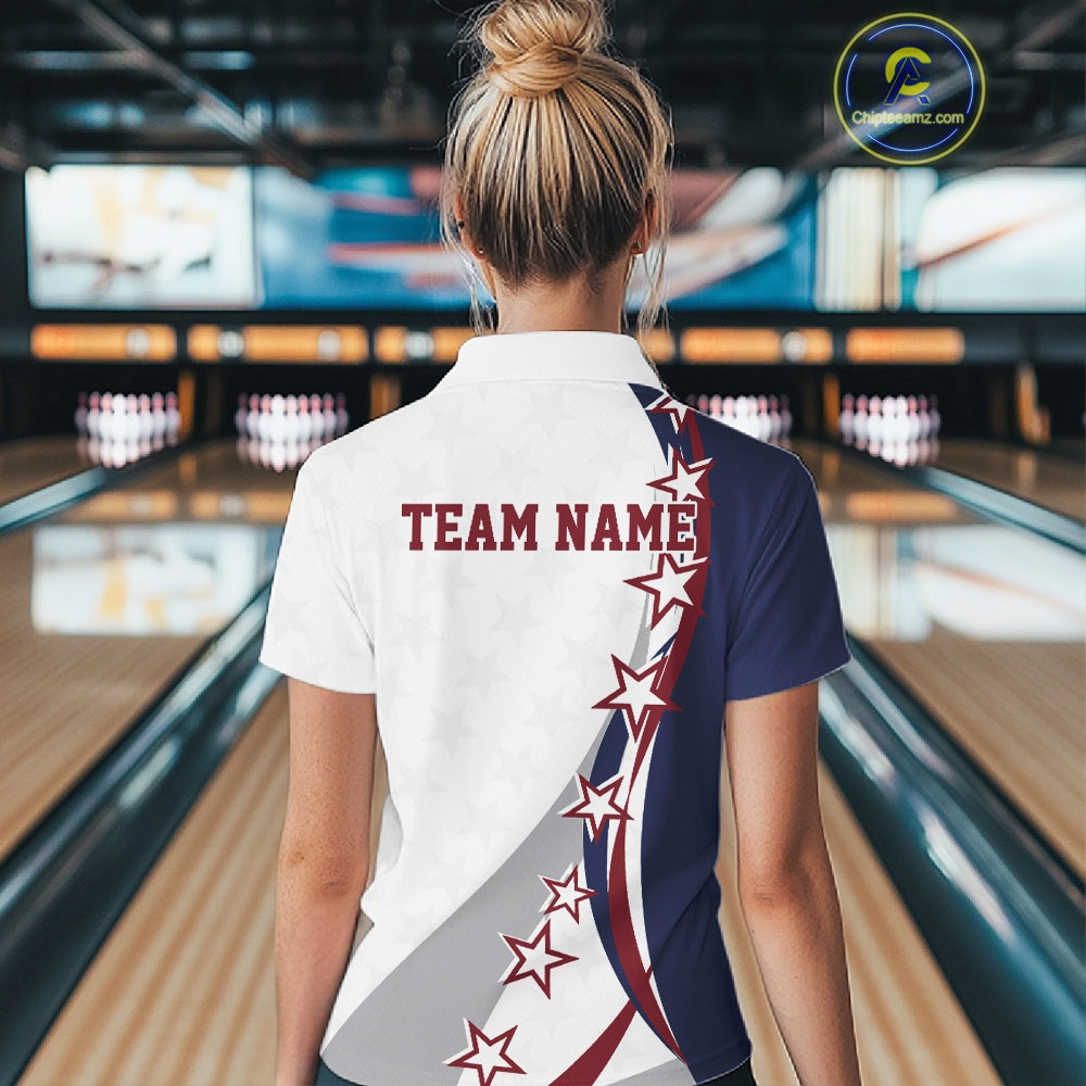 Back view female model in a bowling lane wearing a red, white, and blue quarter zip shirt with sweeping stars and stripe graphics.