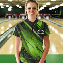 Load image into Gallery viewer, Woman wearing a green and black bowling shirt with a logo in a bowling alley.