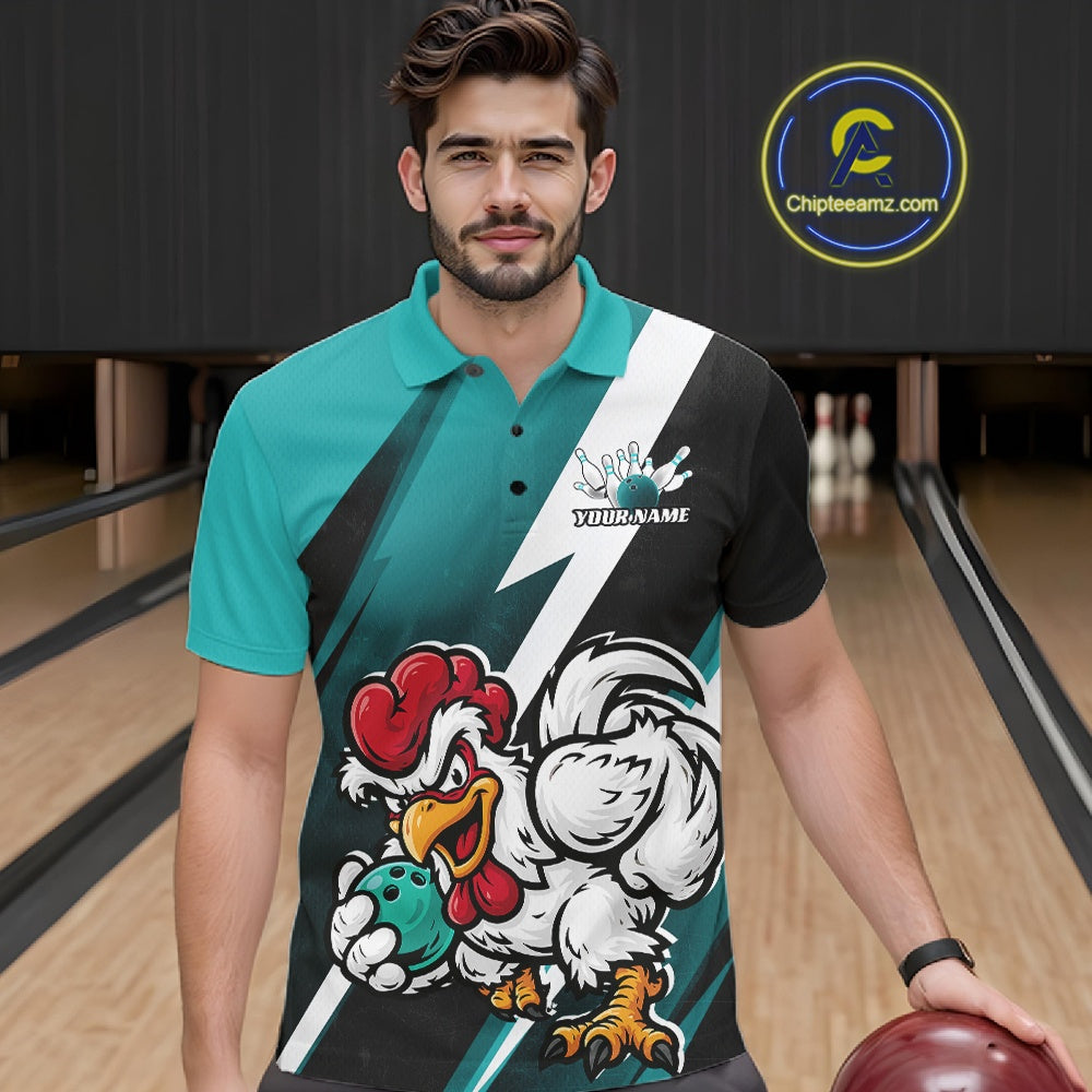 A man in a bowling alley wearing a custom printed short-sleeve polo shirt with a teal, black, and white design featuring a cartoon rooster mascot and the text 'YOURNAME'.