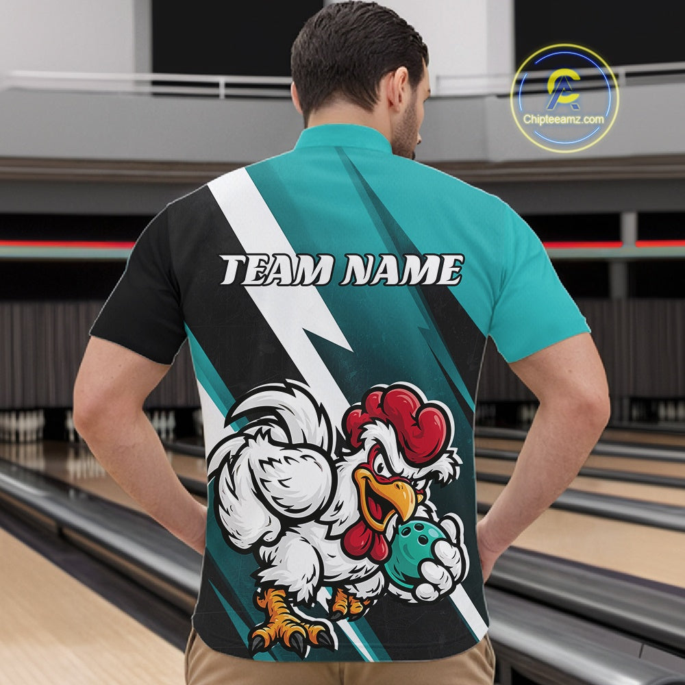 A man viewed from behind wearing a custom bowling shirt with a black and teal design, featuring a large cartoon rooster mascot holding a bowling ball and the text 'TEAM NAME' printed on the back. The background shows bowling lanes.