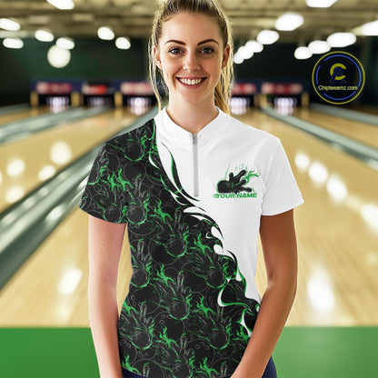 Front view of a female model wearing a white quarter-zip shirt in a bowling lane, featuring green and black flame bowling pattern with dynamic sports styling.