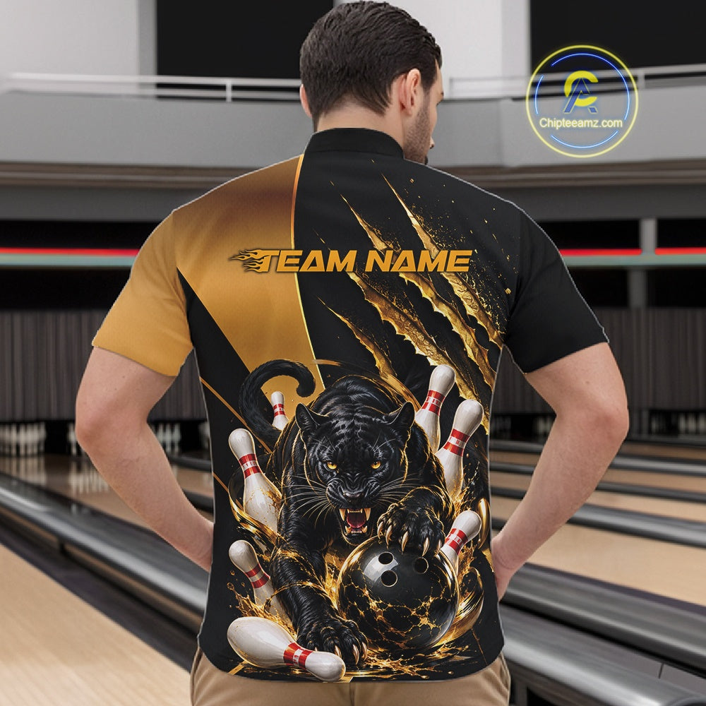 A man viewed from behind wearing a custom bowling jersey with a black and gold design, featuring a graphic of a black panther catching bowling pins and a bowling ball, with 'TEAM NAME' printed across the upper back. The background shows bowling lanes.