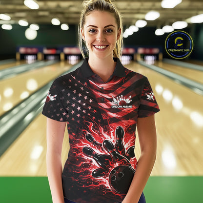 Female model wearing a black bowling polo shirt at the bowling lane with red flame bowling artwork and distressed patriotic details.