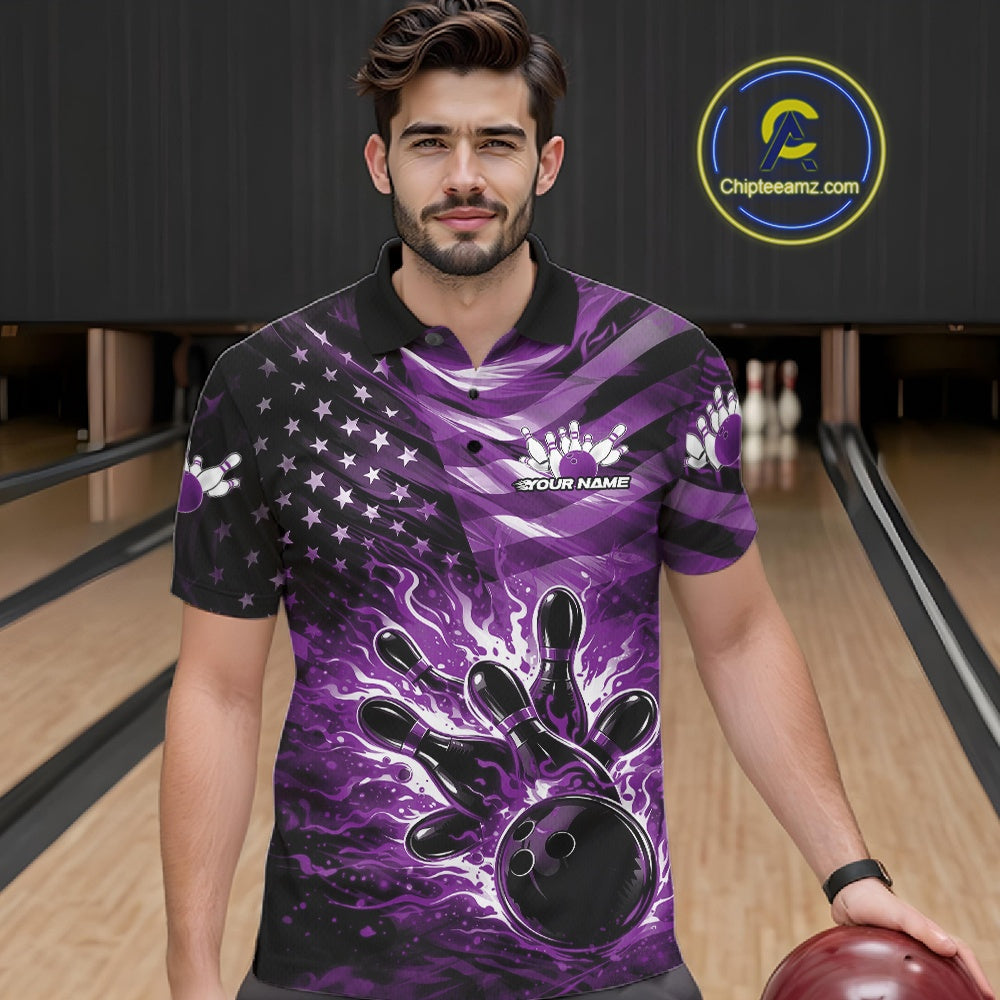 Male model wearing a black bowling polo shirt at the lane with purple flame bowling artwork and patriotic motifs.