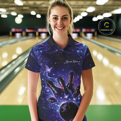 Female model wearing a blue and purple bowling polo shirt at the bowling lane with glowing butterfly bowling artwork.