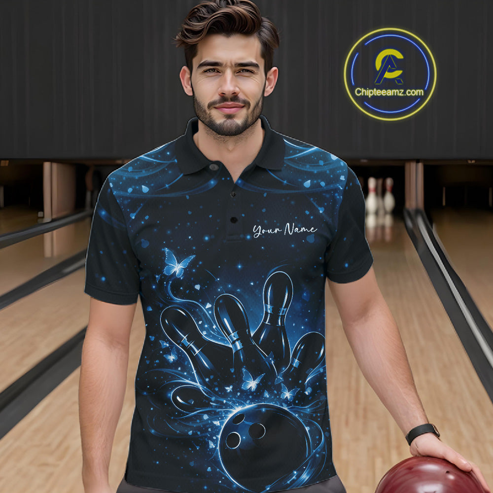 Male model wearing a black and blue bowling polo shirt at the bowling lane with glowing butterfly bowling motifs.