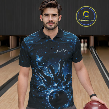 Male model wearing a black and blue bowling polo shirt at the bowling lane with glowing butterfly bowling motifs.