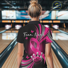Load image into Gallery viewer, Back view of a female model wearing a black and pink bowling polo with breast cancer awareness ribbons, small butterflies, and bowling graphics