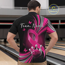 Load image into Gallery viewer, Male model wearing a black and pink bowling quarter zip with pink ribbon artwork, small butterflies, and bowling graphics at the bowling lane