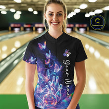 Load image into Gallery viewer, Female model wearing a black bowling quarter zip with starry galaxy artwork, neon swirls, and hologram butterflies, front view inside a bowling alley