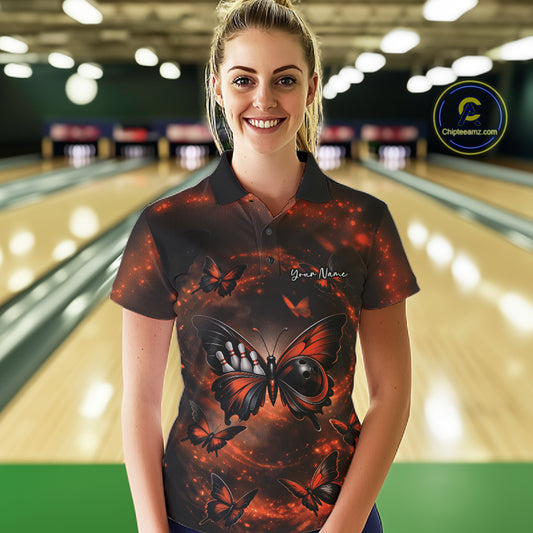 Female model wearing a bowling polo shirt in a bowling center with an orange and black butterfly artwork and bowling ball body design.