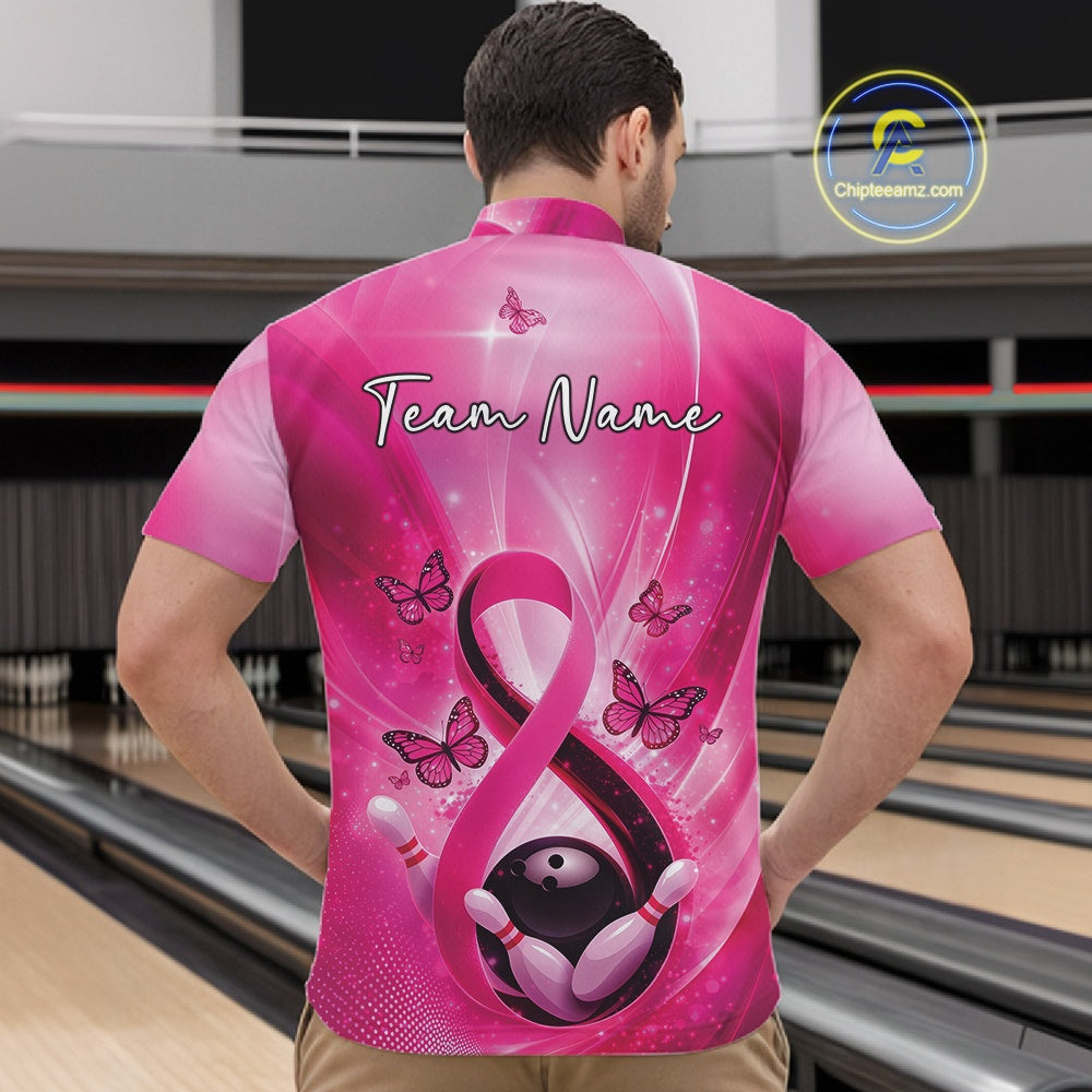 Front view of a mens bowling quarter-zip showcasing a pink awareness ribbon wrapped around a bowling ball with butterfly accents.