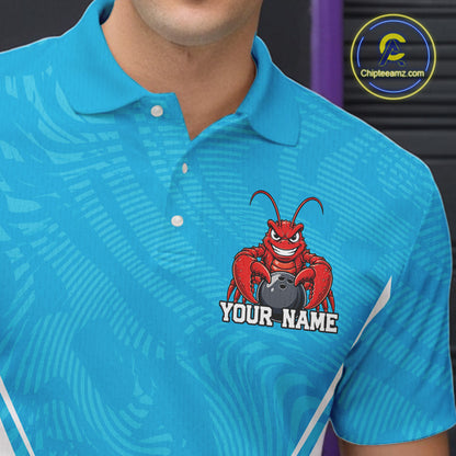 Close-up front view of the left chest area on a blue custom bowling polo shirt featuring a funny aggressive crawfish holding a bowling ball in a sportswear-style design.