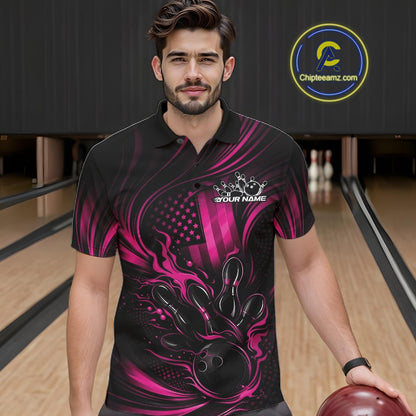 Male model at a bowling lane wearing a black and pink polo shirt with fiery bowling strike artwork and patriotic flag accents.