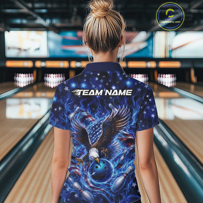 Back view female model at the bowling lane wearing a quarter zip shirt with eagle artwork, bowling ball, flag accents, pins, and blue flames.