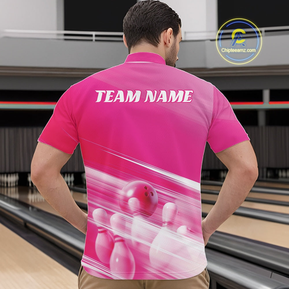Front view of a male model at the bowling lane wearing a pink quarter zip shirt with bowling ball and pins in a geometric pattern.
