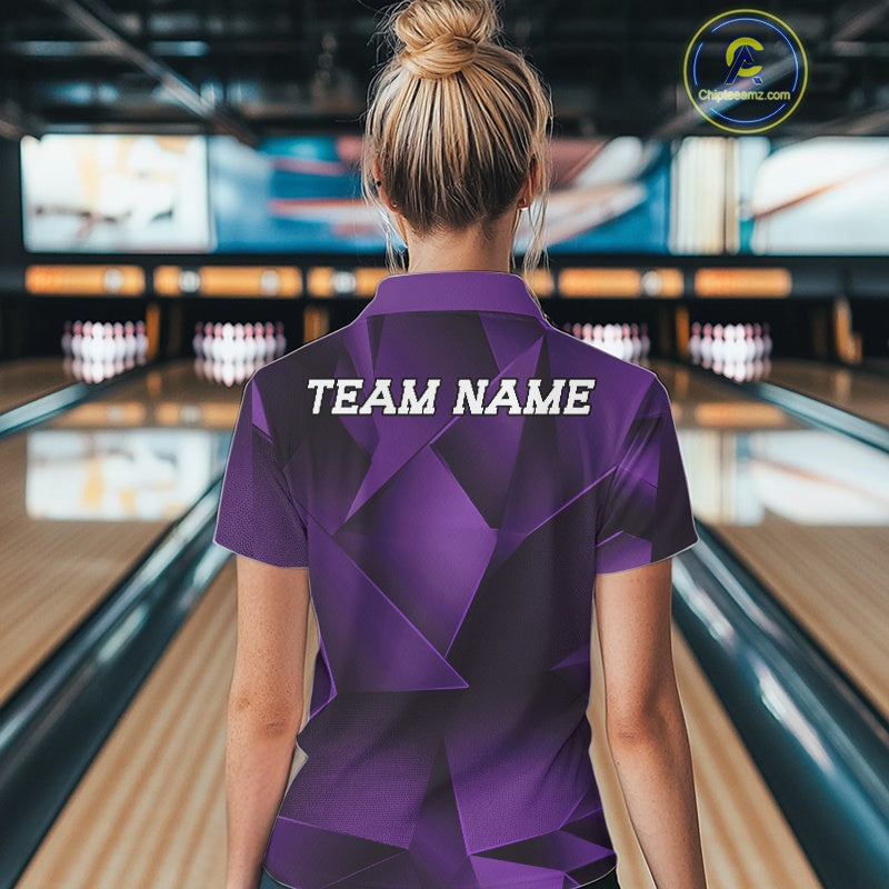 Person wearing a purple bowling shirt with 'TEAM NAME' on the back in a bowling alley.