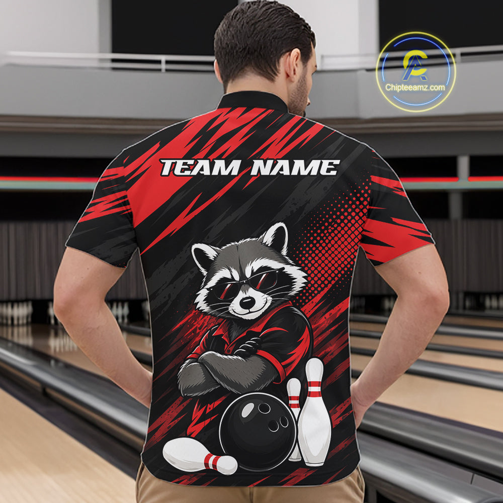A man viewed from behind wearing a custom bowling-themed short-sleeve quarter zip shirt with a raccoon graphic and 'TEAM NAME' text on the back, set against a bowling alley background.