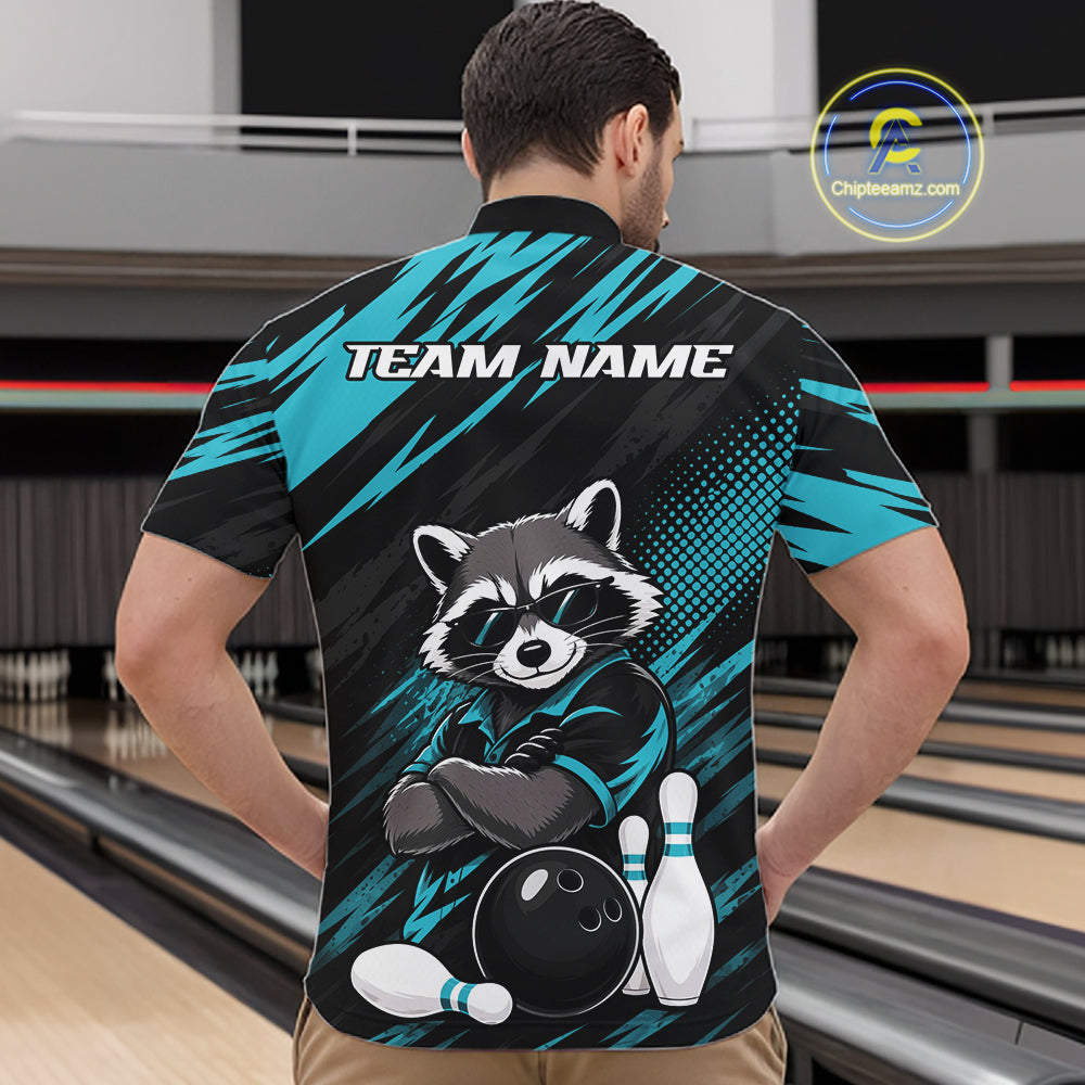 A man viewed from behind wearing a custom bowling-themed short-sleeve quarter zip shirt. The shirt features a raccoon graphic, bowling pins and ball, and the text 'TEAM NAME' on the back, set against a bowling alley background.
