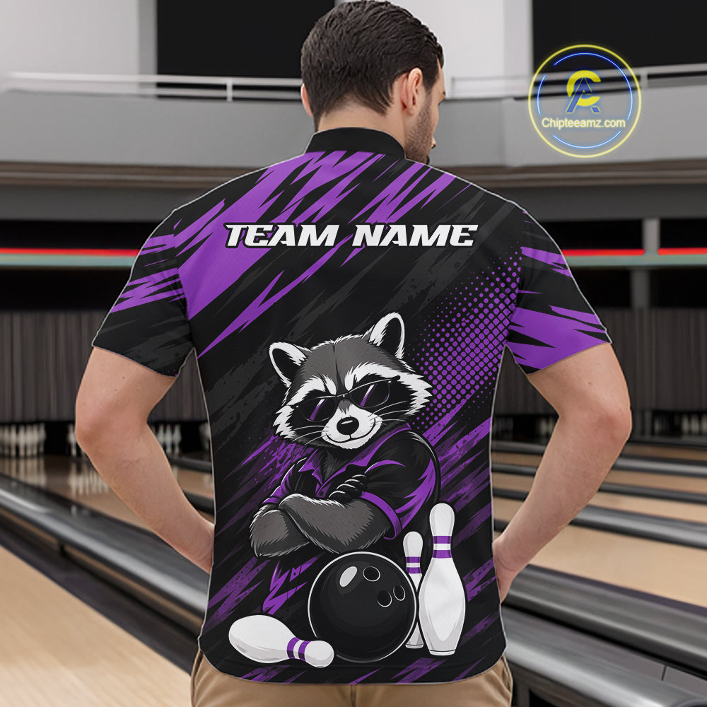 A man viewed from behind wearing a custom bowling quarter zip shirt with a raccoon graphic and 'TEAM NAME' text on the back, set against a bowling alley background.