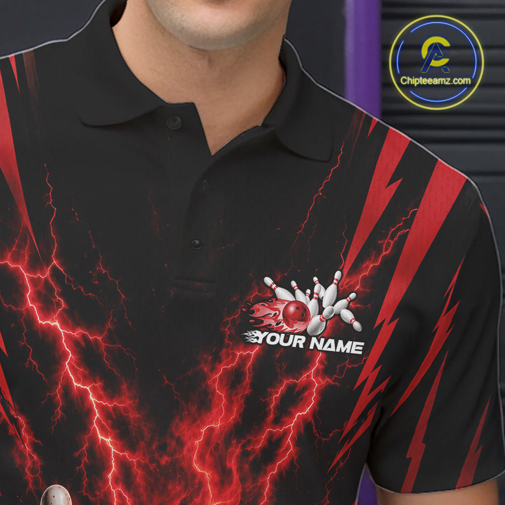 A close-up of a black short-sleeve polo shirt with a red and black lightning-bolt graphic pattern, featuring a bowling pin and ball logo with the text 'YOUR NAME' on the left chest. The image is cropped to show the upper torso of a person wearing the shirt.