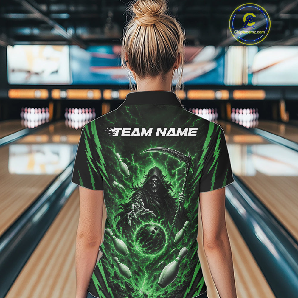 A woman viewed from behind wearing a black short-sleeve bowling-themed polo shirt with a green grim reaper graphic and the text 'TEAM NAME' on the back, standing in a bowling alley.