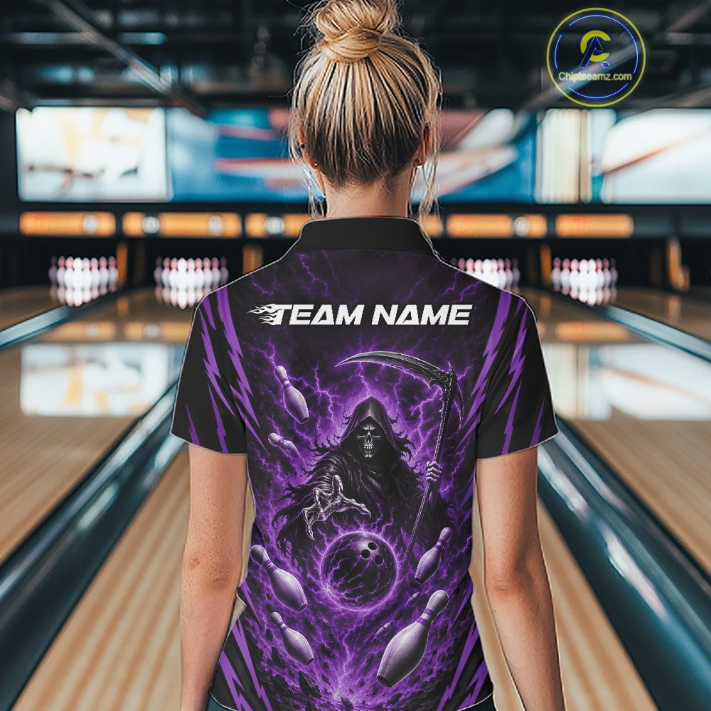A woman viewed from behind wearing a black short-sleeve polo bowling shirt with a large purple grim reaper graphic and the text 'TEAM NAME' on the back, standing in a bowling alley.