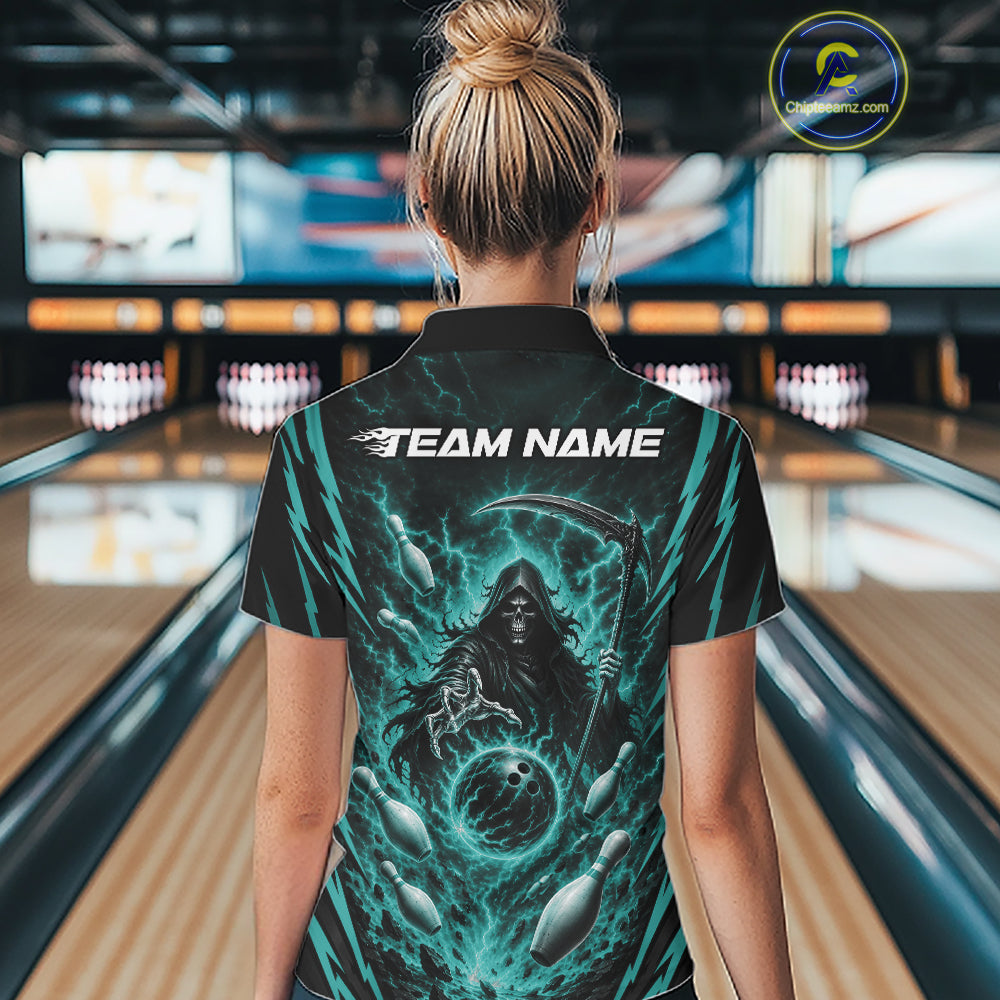 A woman viewed from behind wearing a black short-sleeve bowling jersey with a large teal and black grim reaper graphic and the text 'TEAM NAME' across the upper back, standing in a bowling alley.
