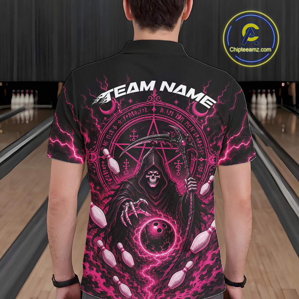 A man viewed from behind wearing a black short-sleeve polo shirt with a large pink and white graphic print featuring a grim reaper, bowling pins, lightning, and the text 'TEAM NAME'. The background shows a bowling alley with lanes and pins.
