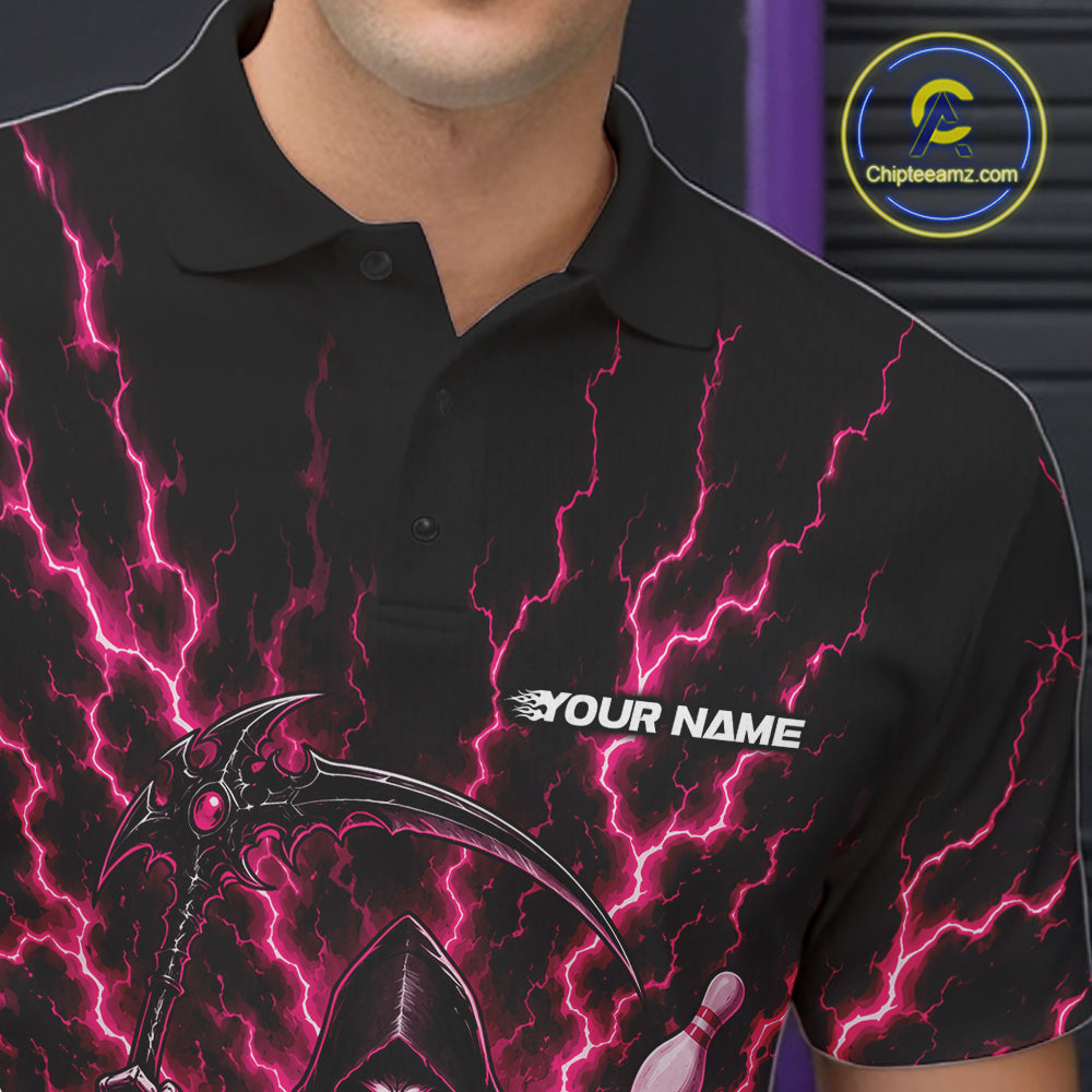 A close-up of a black short-sleeve polo shirt worn by a model, featuring a vibrant pink lightning bolt pattern and a grim reaper graphic on the front. The shirt has a white customizable text placeholder reading 'YOUR NAME' on the chest.