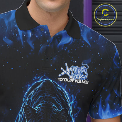 Close-up view of the left chest of a black polo shirt showing glowing blue electric panther artwork with bowling ball crashing through pins detail.