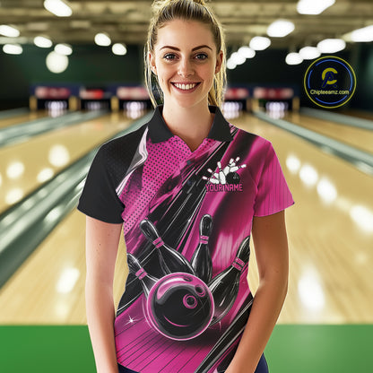 Female model wearing a black and pink bowling polo shirt at the bowling lane with energetic bowling strike graphics.