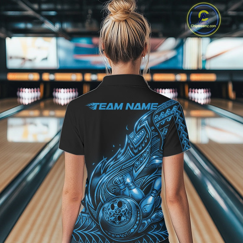 Back view of a female model in a black and blue bowling quarter-zip shirt displaying tribal flame bowling motifs.