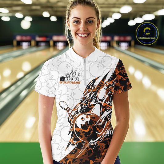 Female model wearing a white bowling quarter-zip shirt at the bowling lane with yellow camo bowling artwork and faint ball details.