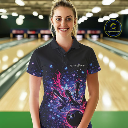 Female model wearing a colorful bowling polo shirt at the lane with flames, bowling pins, and butterfly graphics.