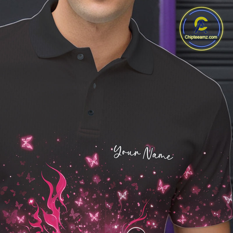 Left chest close-up of a black and pink bowling polo shirt with fiery bowling artwork and sparkling butterflies.