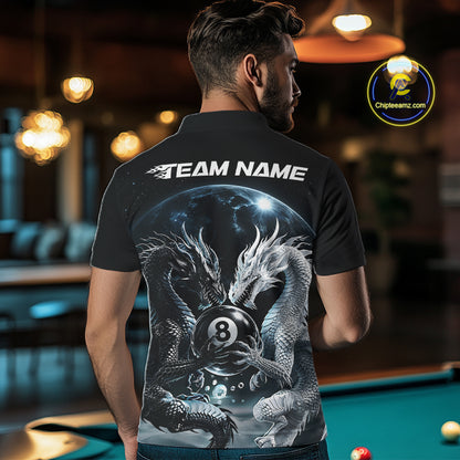 A man viewed from behind wearing a black billiard short-sleeve polo shirt with a large back graphic showing two silver-gray dragons around an 8-ball under a galaxy sky, with 'TEAM NAME' printed in white across the shoulders. 