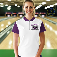 Load image into Gallery viewer, A woman stands in a bowling alley wearing a bowling shirt with quarter zip collar, purple skull-themed bowling graphic with black wings, pins, bowling ball