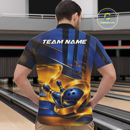 Male model wearing a bowling quarter zip shirt with a glossy blue bowling ball striking pins and flowing gold ribbon artwork, shown from the front in a bowling lane.