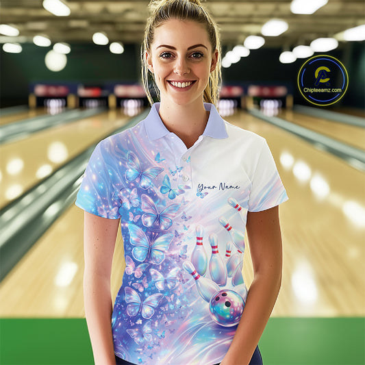 Front view of a female model wearing a bowling polo with pastel purple and pink holographic butterflies and vibrant bowling-themed graphics