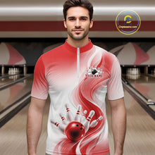 Load image into Gallery viewer, Front view of a male model wearing a white and red bowling quarter-zip shirt with elegant wave patterns and a bowling ball striking pins