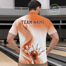 Load image into Gallery viewer, Male model in a bowling alley wearing a white and orange bowling quarter-zip shirt with dynamic wave patterns and bowling pin action imagery