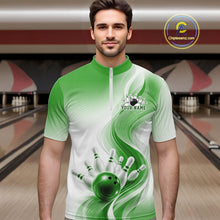 Load image into Gallery viewer, Male model in a white and green bowling quarter zip shirt with abstract flowing wave accents and glossy bowling strike graphics, front view at a bowling lane