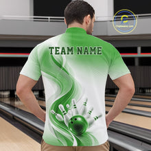 Load image into Gallery viewer, Front view of a male model wearing a white and green bowling quarter-zip shirt with fluid wave accents and a glossy bowling scene