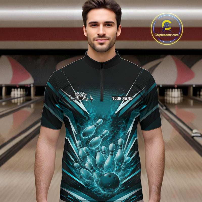 Male model in bowling lane wearing quarter-zip shirt with flaming bowling ball striking pins turquoise blue dynamic sports artwork