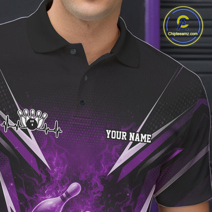 Close-up of the left chest graphic on a black and purple bowling polo featuring a flaming bowling strike illustration.